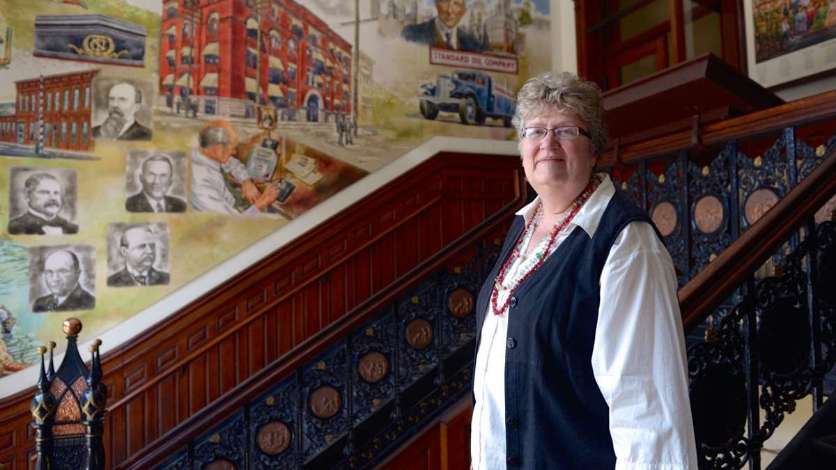  Joann Wheeler head of the artist relocation program in Oil City stands in the lobby of the national Transit Building.  (Kelly Tunney/for WPSU) 