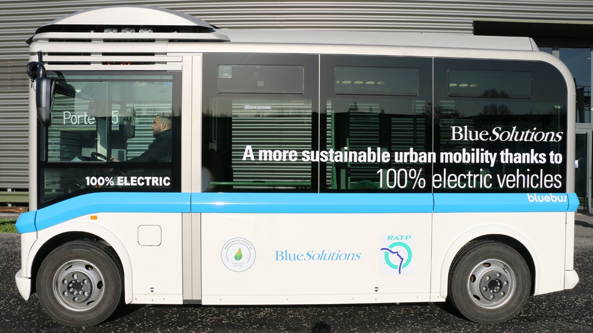 Small electric buses transport visitors to the “Gallery of Solutions.” After the Paris climate change summit