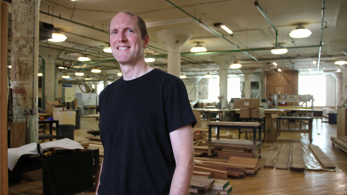 Paul Downs specializes in making custom conference tables for businesses around the world. After blogging for the New York Times, he wrote a book about the ups and downs of running a small business. (Emma Lee/WHYY)