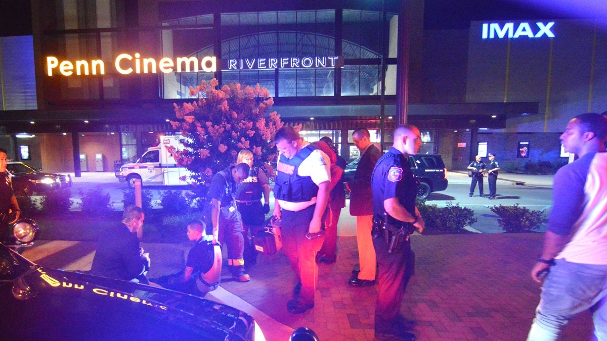 penn-cinema-shooting-169 Police stand outside the Penn Cinema at the Wilmington Riverfront after a shooting victim was found in theater parking lot. (John Jankowski/for NewsWorks)