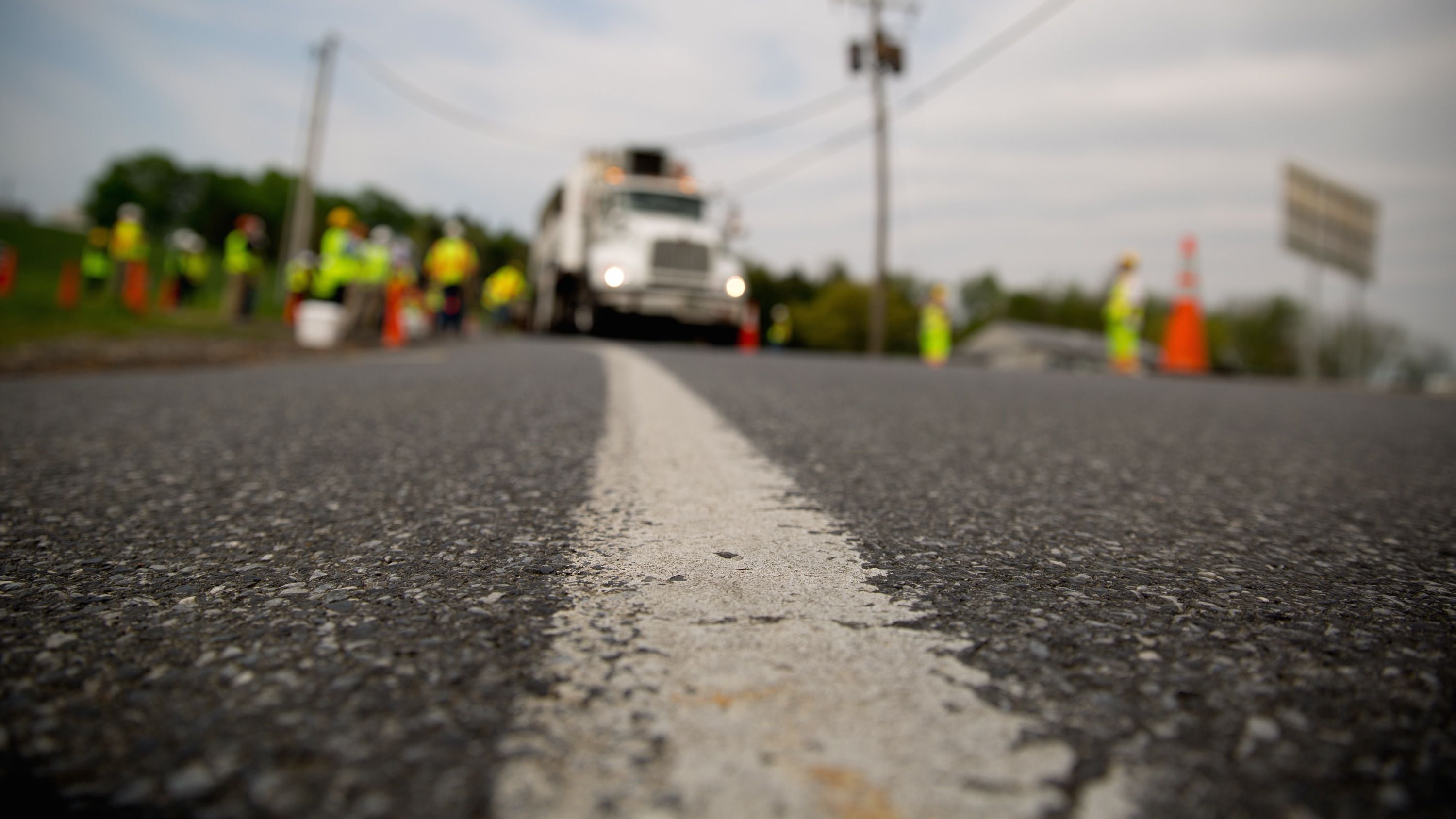 Workers apply high-friction surface treatment on Route 241 in Lebanon County. (Courtesy of PennDOT) 
