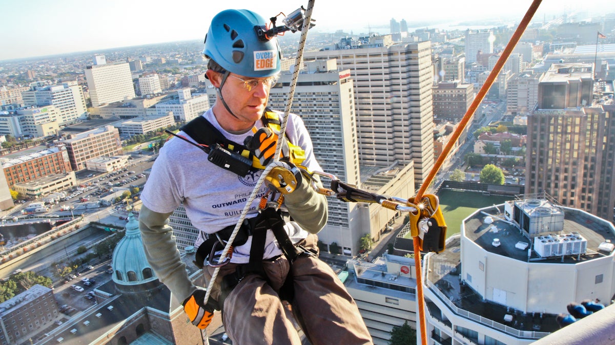  WHYY's Peter Crimmins rappels down 1 Logan Square. (Kimberly Paynter/WHYY) 