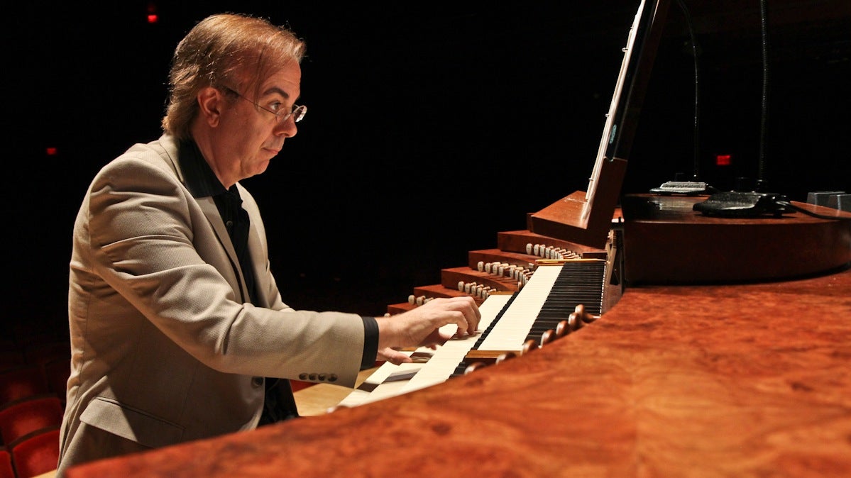  Organist Peter Richard Conte plays the Fred J. Cooper Memorial Organ to score a puppet performance of 'Peter and the Wolf.' The organ is the largest mechanical action concert hall organ in the U.S. (Kimberly Paynter/WHYY) 