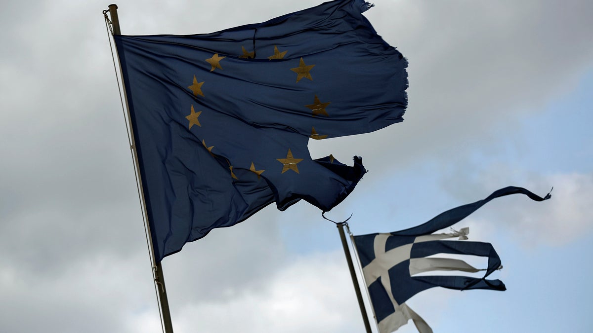  Ruined EU and Greek flags fly in tatters from a flag pole at a beach at Anavissos village, southwest of Athens, in March.  (Yorgos Karahalis/AP Photo) 