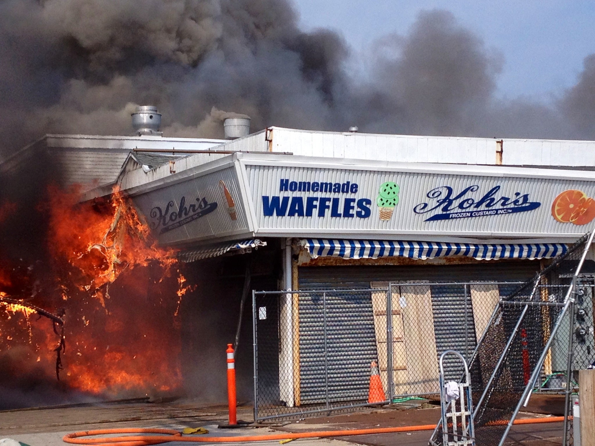  Flames shoot out of Kohr's during the early stages of the last week's fire. (Photo: Justin Auciello/Jersey Shore Hurricane News) 