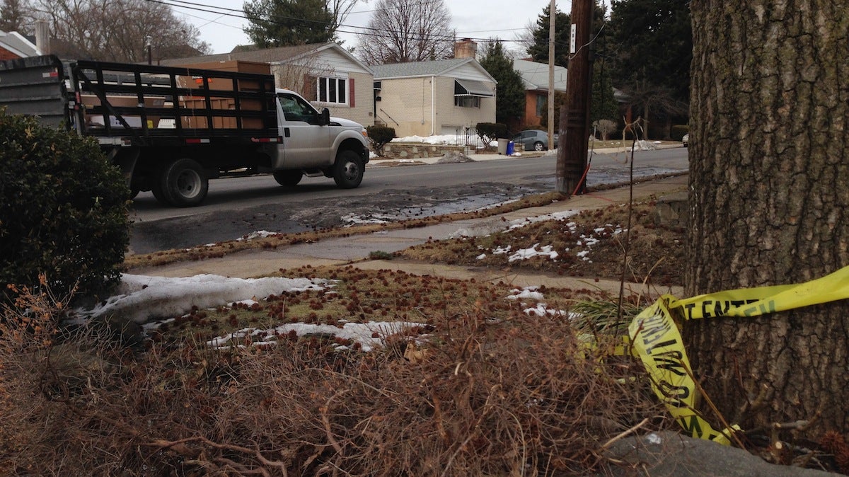  Caution tape remains at the site of a Thursday night hit-and-run on Domino Lane in Roxborough. (Brian Hickey/WHYY) 