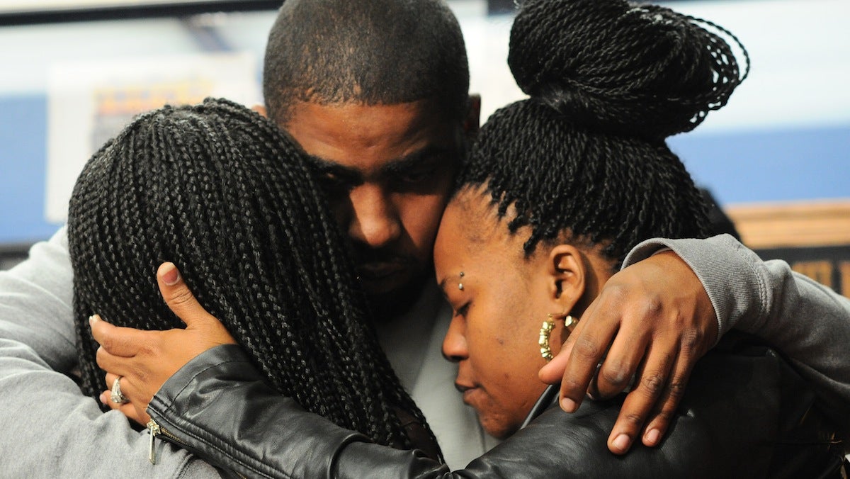  Carlesha Freeland-Gaither's family consoling one another at a press conference on Tuesday afternoon. Her mother, Keisha, is on the right. (Bas Slabbers/for NewsWorks) 