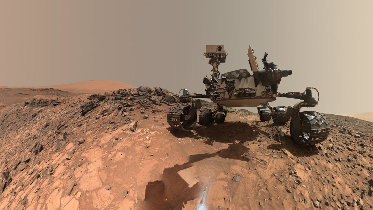  Mars rover Curiosity takes a self portrait on lower Mount Sharp in Gale Crater. Researchers analyzed images of pebbles taken by the rover and found some of the rocks had once traveled long distances in a river. (Image courtesy of NASA) 