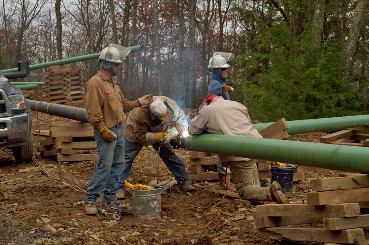Crews are shown welding a pipeline connecting to a natural gas well in northern Pennsylvania. The Mariner East 2 plan would build two natural gas pipelines across southern Pennsylvania. (Lindsay Lazarski/WHYY
