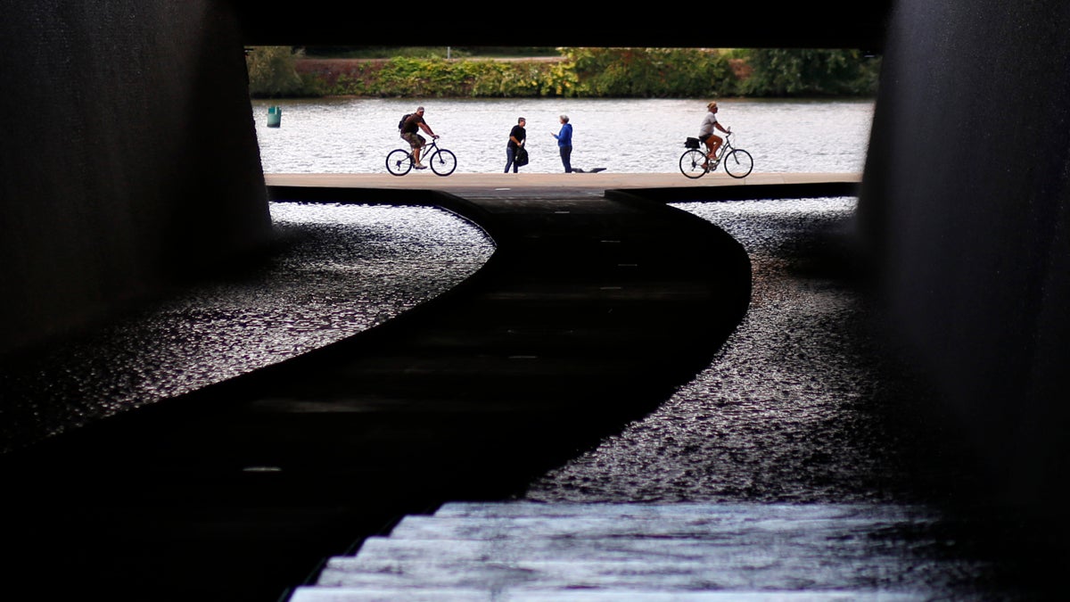 Pedestrians and cyclists use the river walk along the Allegheny River in downtown Pittsburgh.  Under changes to the Act 47 law