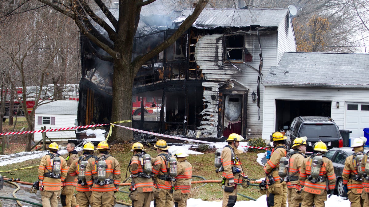  Montgomery County, Maryland,  firefighters stand outside the house where a small private jet crashed in Gaithersburg, Maryland, on Dec. 8, killing Marie Gemmell and her two young sons. (Jose Luis Magana/AP Photo) 