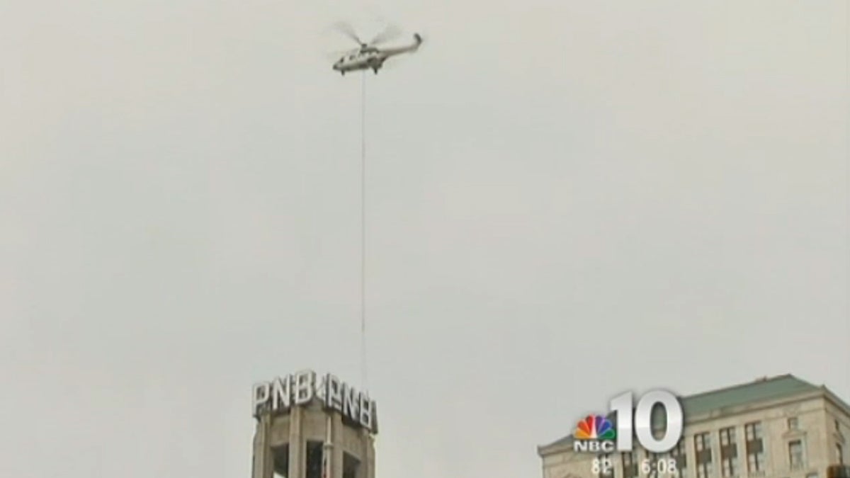  Safety concerns prevented crews from removing all 12 letters from the former Philadelphia National Bank building on South Broad Street on Sunday. (Image courtesy of NBC 10 video) 