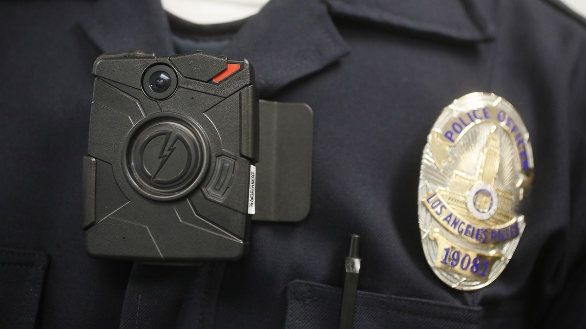 police-camera-169 In this file photo, a Los Angeles Police officer wears an on-body camera during a demonstration for media. The fatal police shooting of the unarmed black teenager in Ferguson, Mo. has prompted calls for more officers to wear so-called