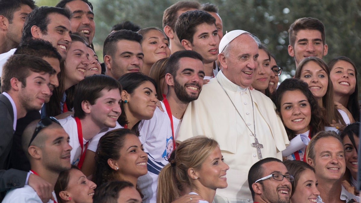  Pope Francis poses for a photo after a meeting with youths in downtown Cagliari, Italy, Sunday, Sept. 22, 2013. Francis denounced what he called big business's idolatry of money over man as he traveled Sunday to one of Italy's poorest regions to offer hope to the unemployed and entrepreneurs struggling to hang on. (AP Photo/Alessandra Tarantino) 