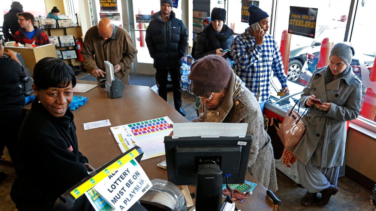  A line forms over the lunch hour at a minimart in Pittsburgh to purchase a chance at the record $1.5 billion Powerball jackpot, Wednesday, Jan. 13, 2016. (AP Photo/Gene J. Puskar) 