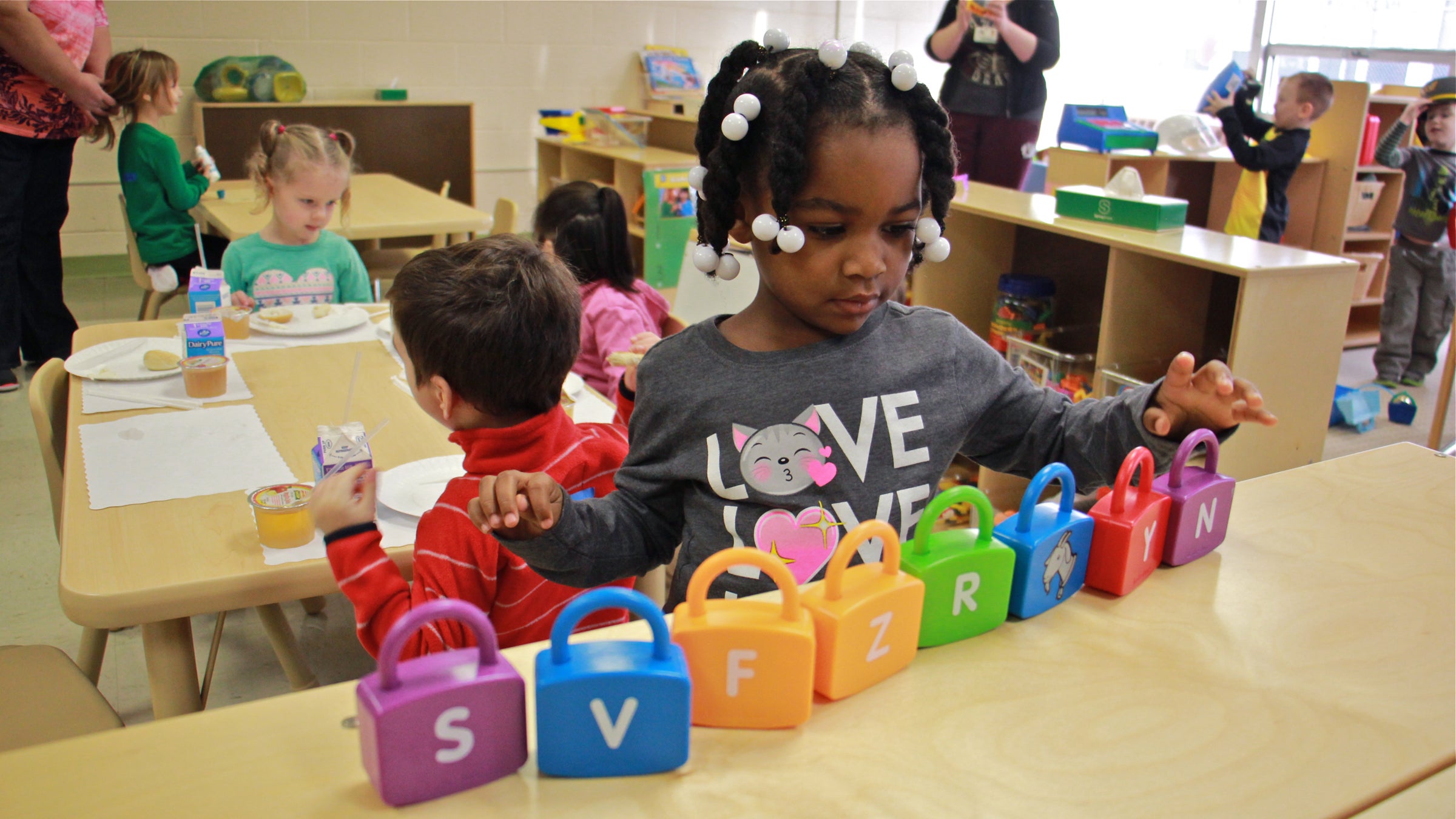 Makayla Grant gets busy on her first day of preschool at SPIN-Parkwood on Jan. 4