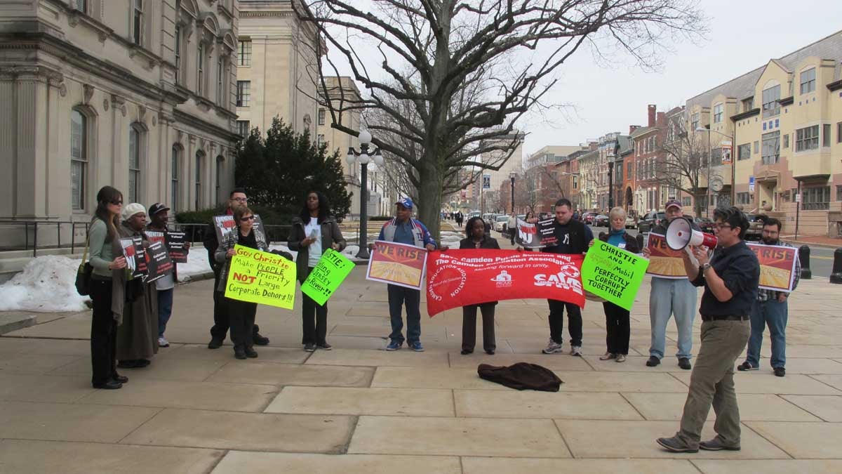  Protesters rally outside the New Jersey State House in Trenotn to call attention to budgetary priorities they say are out of kilter. (Phil Gregory/WHYY)  