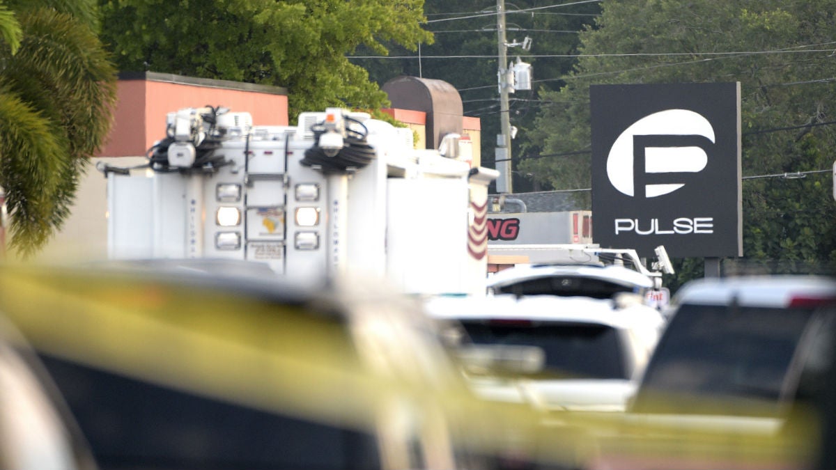 Police cars and emergency vehicles surround the Pulse Orlando nightclub
