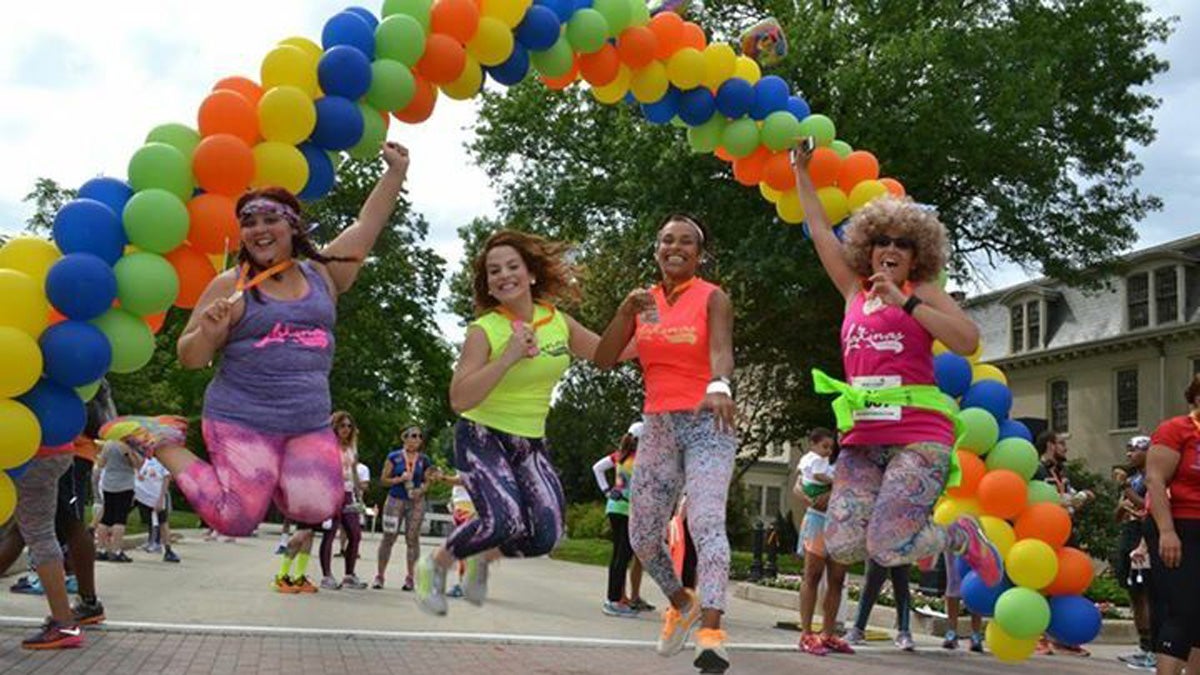 At a recent Latinas in Motion event, women and girls encourage others -- and one another -- to become active. (Momentos by Luz Photography) 