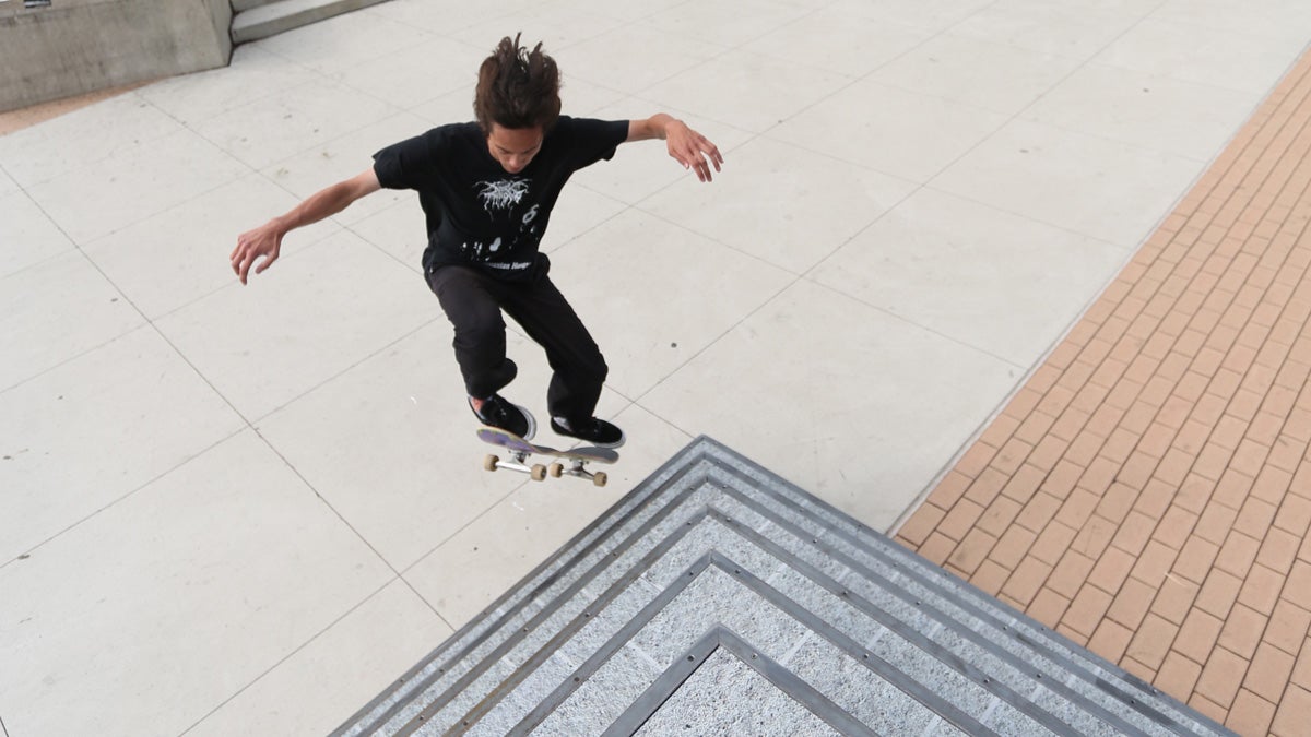  A skateboarder tries out the skatable sculpture 