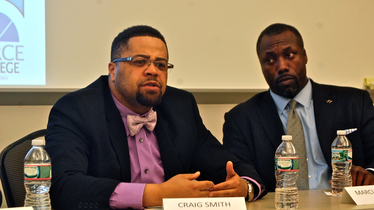  Panelist Craig Smith of Year Up Philadelphia speaks while Marcus Allen, CEO of Big Brothers/Big Sisters Southeastern Pennsylvania, listens during a discussion on race relations at Peirce College. (Sara Hoover/for NewsWorks) 