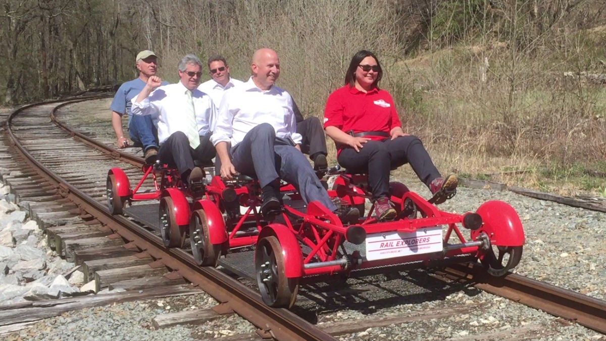 Delaware Governor Jack Markell takes on of the first rides on the Rail Explorers bikes through scenic Yorklyn. (Zoë Read/WHYY)