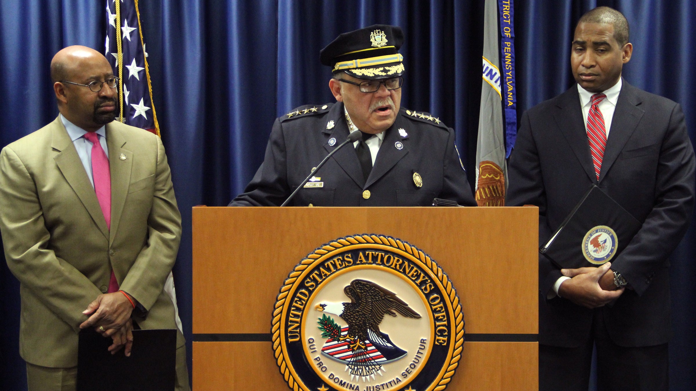  You can see the camera over the shoulder of Philadelphia Police Chief Charles Ramsey as he touts the success of the city's SafeCam program and pushes for greater participation at a press conference in Chinatown. (Emma Lee/WHYY) 