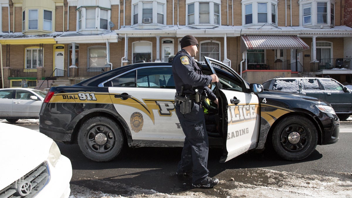  Police officer Jacob Stefani makes a patrol stop at an abandoned property in the Northeast section of Reading, Pennsylvania. (Lindsay Lazarski/WHYY) 