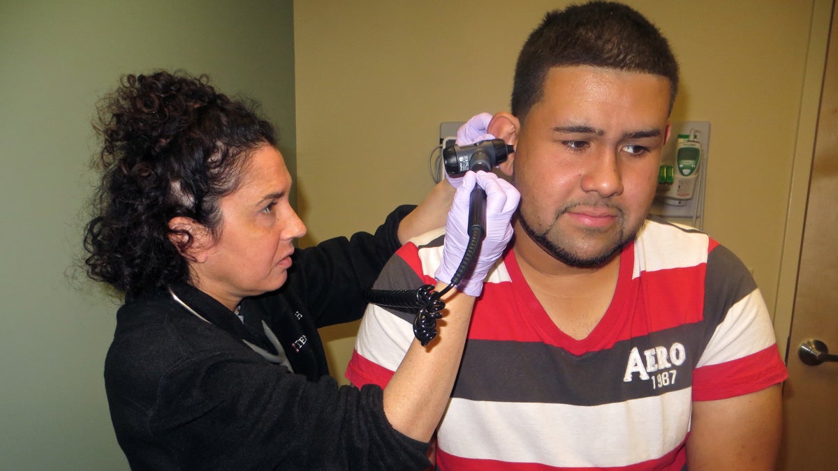 readycare Dr. Robyn Baron examines 25-year-old Jerry Rodriguez at the newest Temple ReadyCare urgent care site on Cottman Avenue in Northeast Philadelphia. (Taunya English/WHYY)