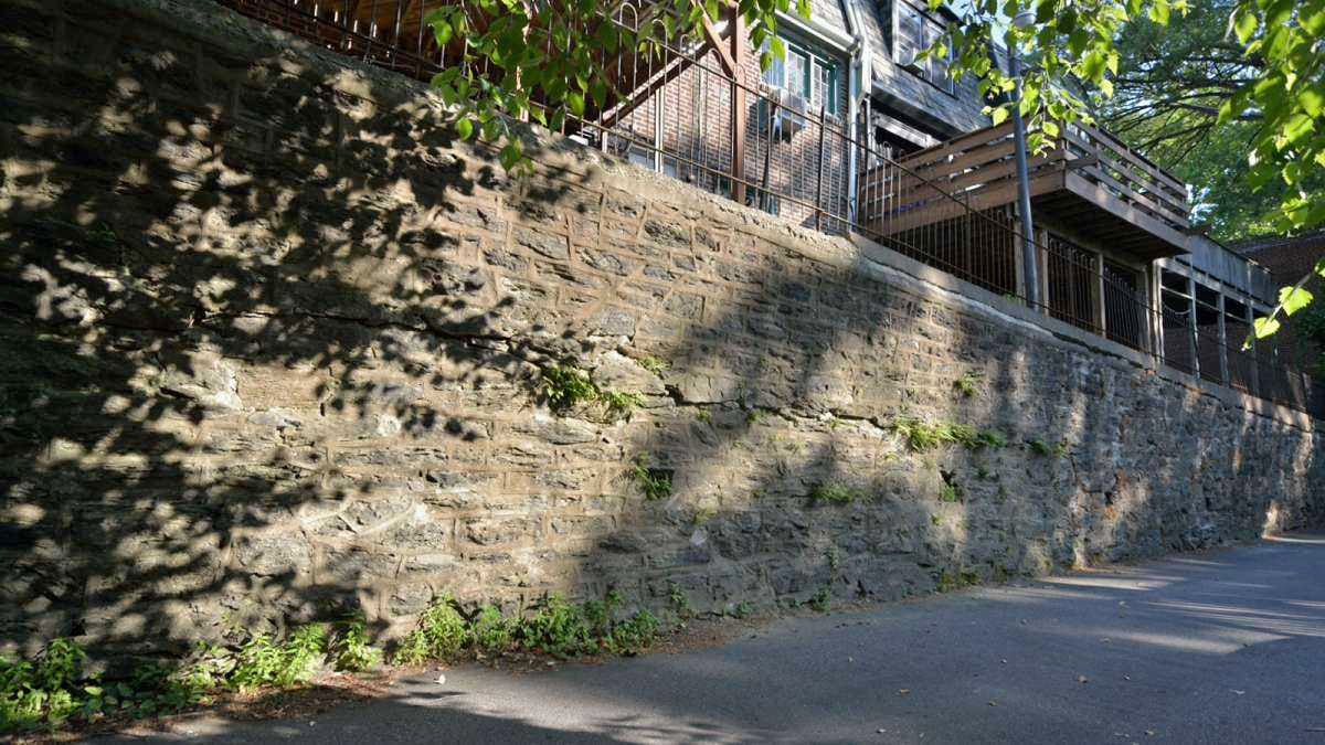  Sections of a 550-foot-long retaining wall in the East Falls neighborhood of Philadelphia are leaning, cracked, and unsafe, affecting the owners of 65 homes on either side of the wall. (Bas Slabbers/for NewsWorks, file photo) 