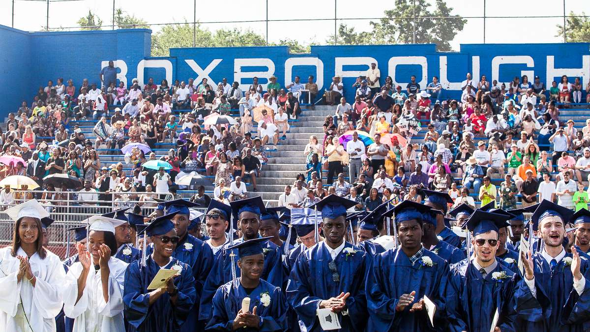  Grads and packed bleachers at the Roxborough High School 2014 Commencement. (Brad Larrison/for NewsWorks, file) 