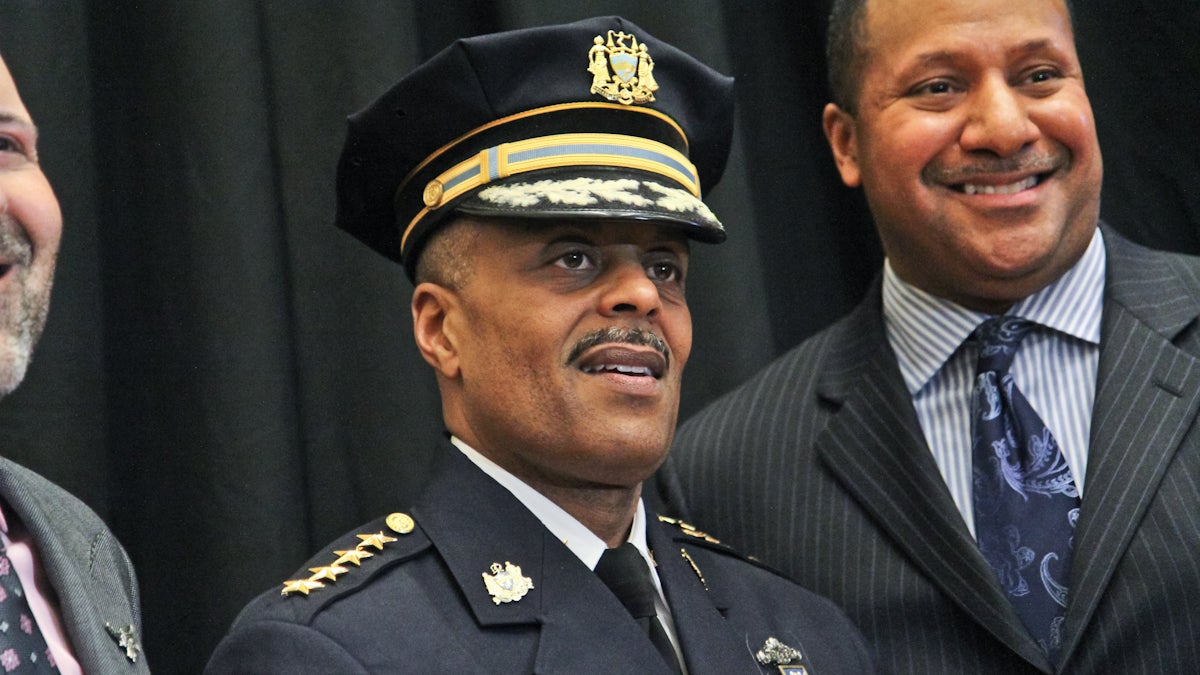 Richard Ross poses for photos with PPD officers after being sworn in as Philadelphia's Police Commissioner. (Kimberly Paynter/WHYY)