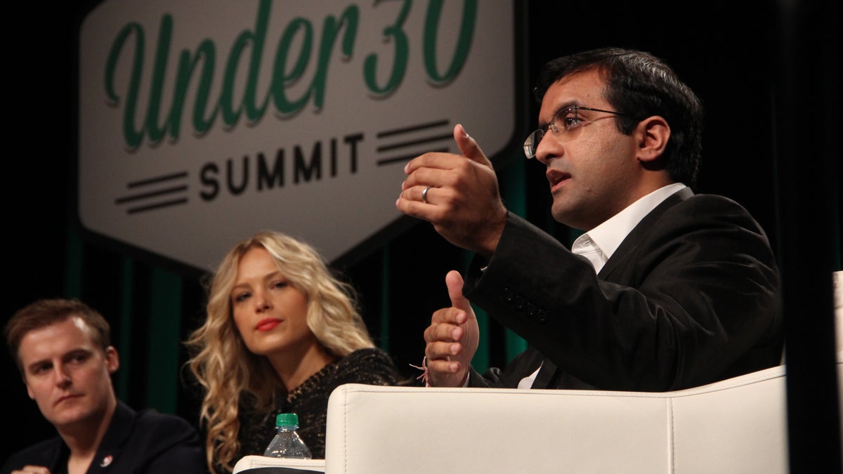  Dr. Raj Panjabi, co-founder of Last Mile Health, shares the stage with humanitarian Hugh Evans and supermodel Petra Nemcova during a panel discussion on saving the world at the Forbes Under 30 Summit. (Emma Lee/WHYY) 