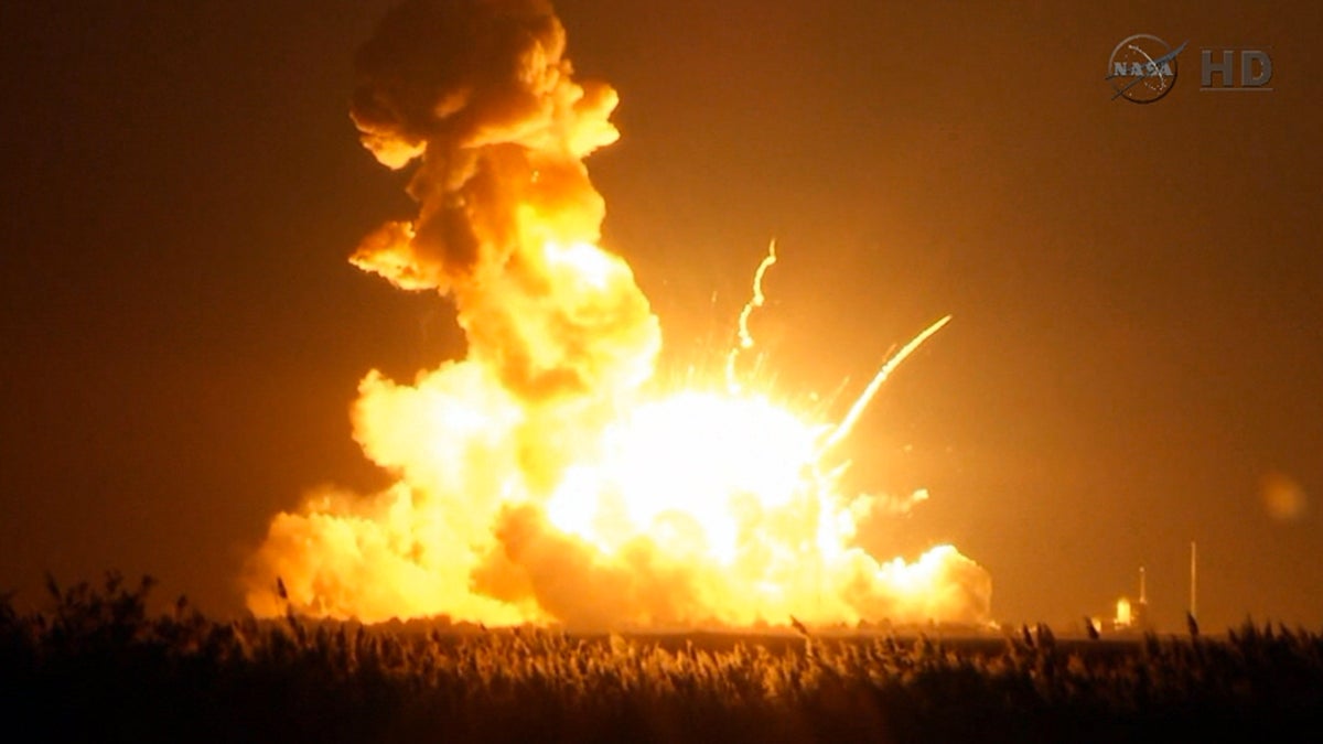 This image taken from video provided by NASA TV shows Orbital Sciences Corp.'s unmanned rocket blowing up over the launch complex at Wallops Island