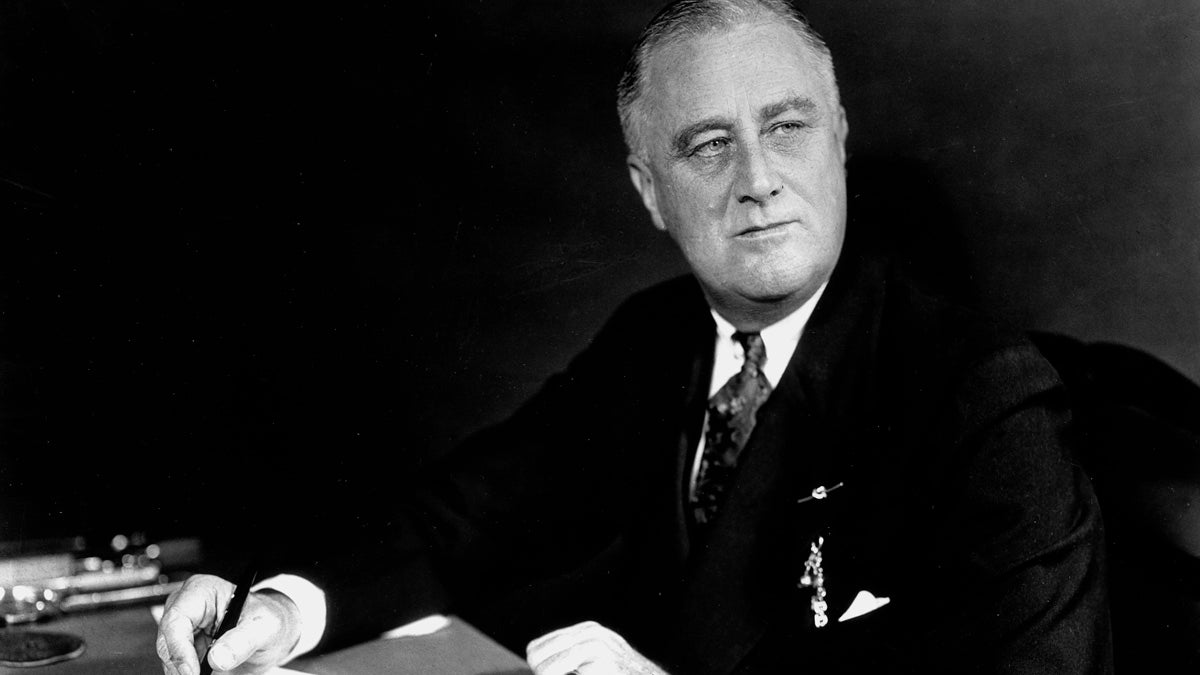  U.S. President Franklin D. Roosevelt is seen on the eve of his inauguration for a second term on Jan. 19, 1937, at his desk in the White House in Washington.  (AP Photo) 