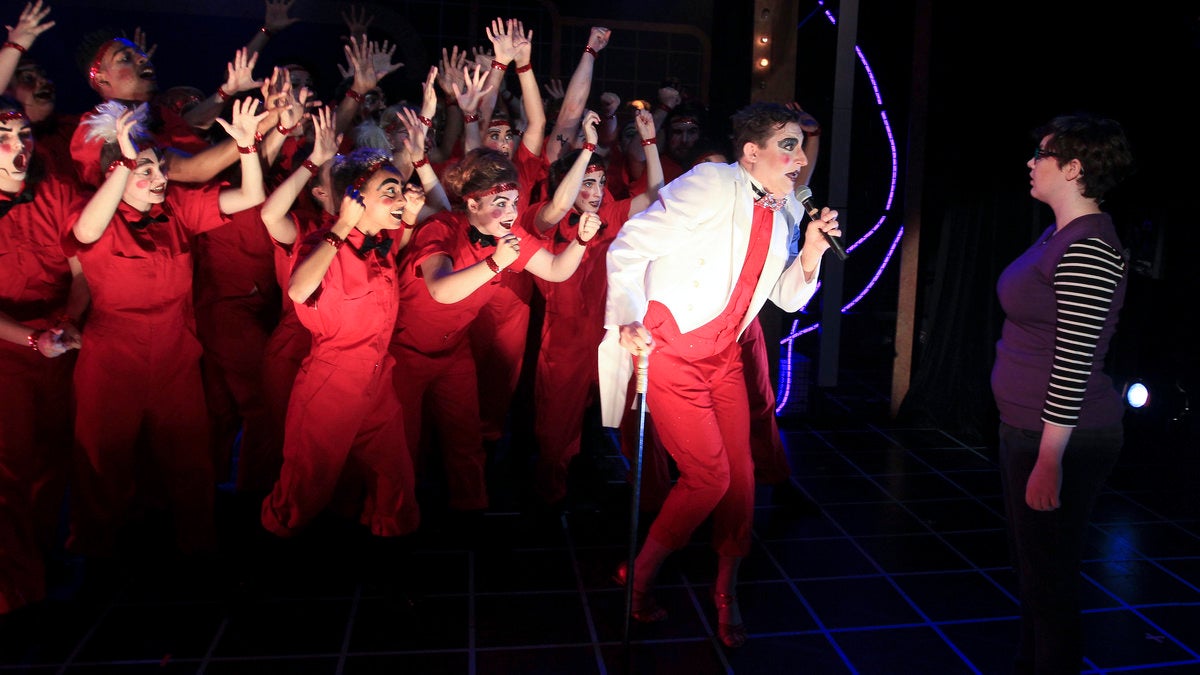 Salty Brine (in white jacket)  and the ensemble of 'The Elementary Spacetime Show' sing to Julia Louis at the Philly Fringe Festival. (Photo courtesy of Paola Nogueras)