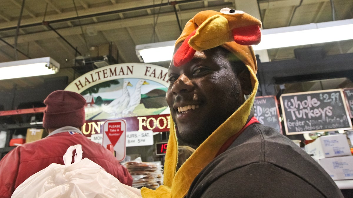 A worker in the Thanksgiving spirit at Reading Terminal Market Wednesday. (Kimberly Paynter/WHYY)