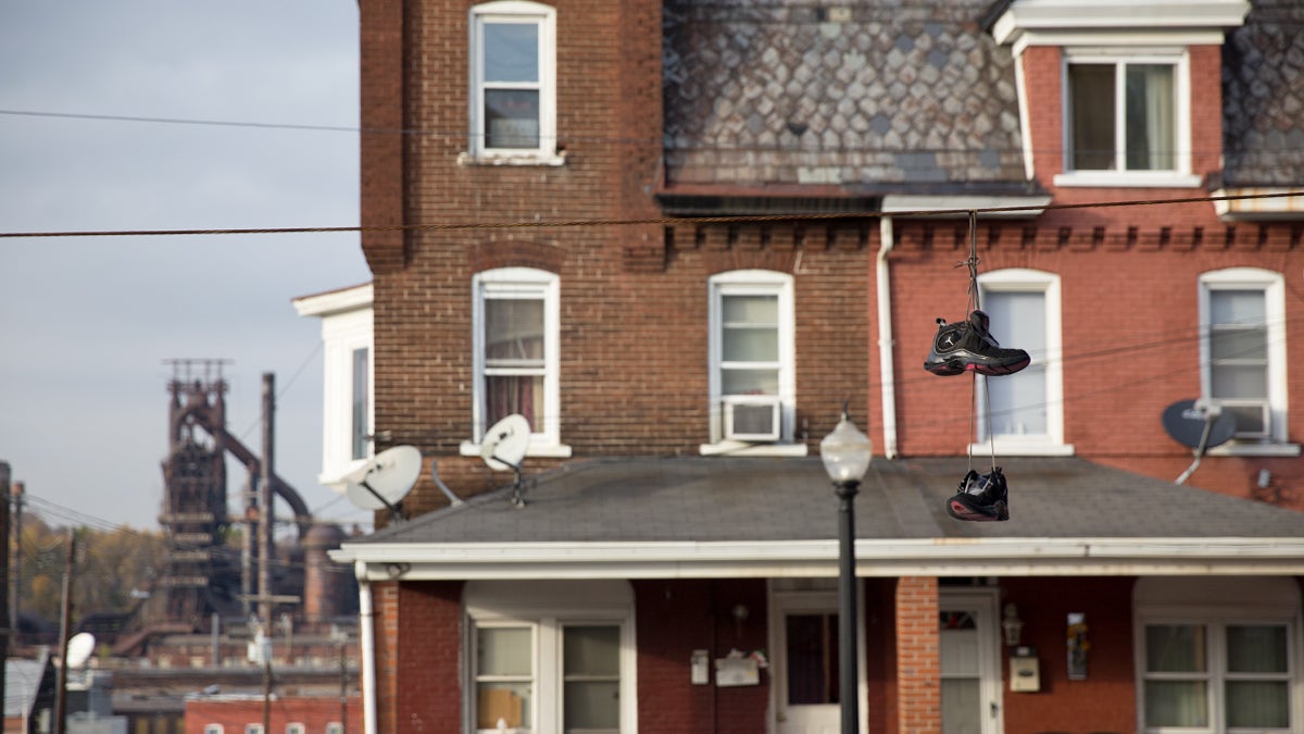  A pair of Jordan’s hang from a wire on Bethlehem’s southside.  The struggling neighborhood has long lived in the shadow of Bethlehem Steel and Lehigh University. (Lindsay Lazarski/WHYY) 