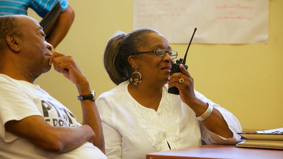  Sharon Poindexter, from Northwest Philadelphia, practiced her communication via walkie-talkie and learned some of the code words. (Nathaniel Hamilton/for NewsWorks) 