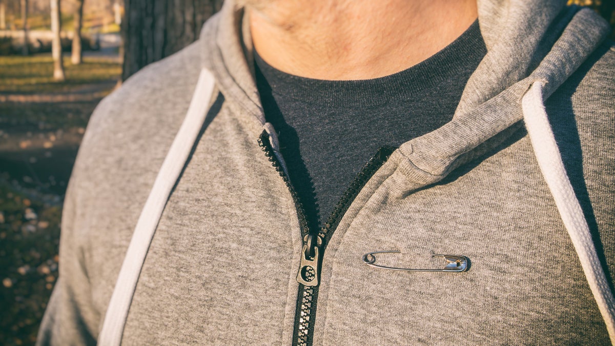 Hint: Wearing a safety pin is not enough if you want to be an active ally. (<a href='http://www.bigstockphoto.com/image-156762293/stock-photo-man-wearing-a-safety-pin-as-a-symbol-of-solidarity'>Mbruxelle</a>/Big Stsock Photo)