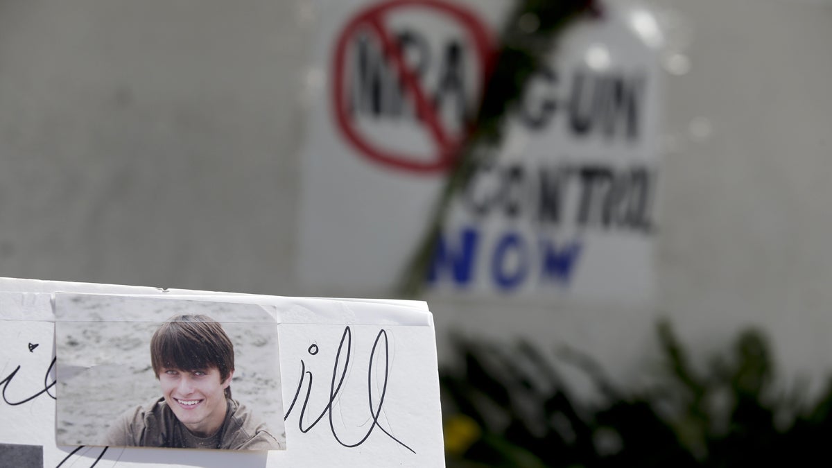  Images of Chrisotper Ross Michael-Martinez are displayed as part of a makeshift memorial in front of the IV Deli Mart, where part of Friday night's mass shooting took place by a drive-by shooter in the Isla Vista area near Goleta, Calif. (AP Photo/Chris Carlson) 