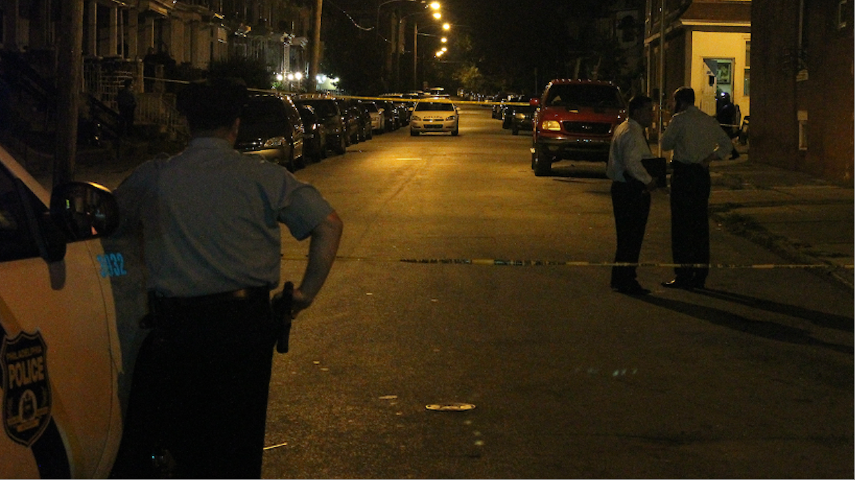  Police on the scene of Tuesday night's fatal shooting in Germantown. (Matthew Grady/for NewsWorks) 
