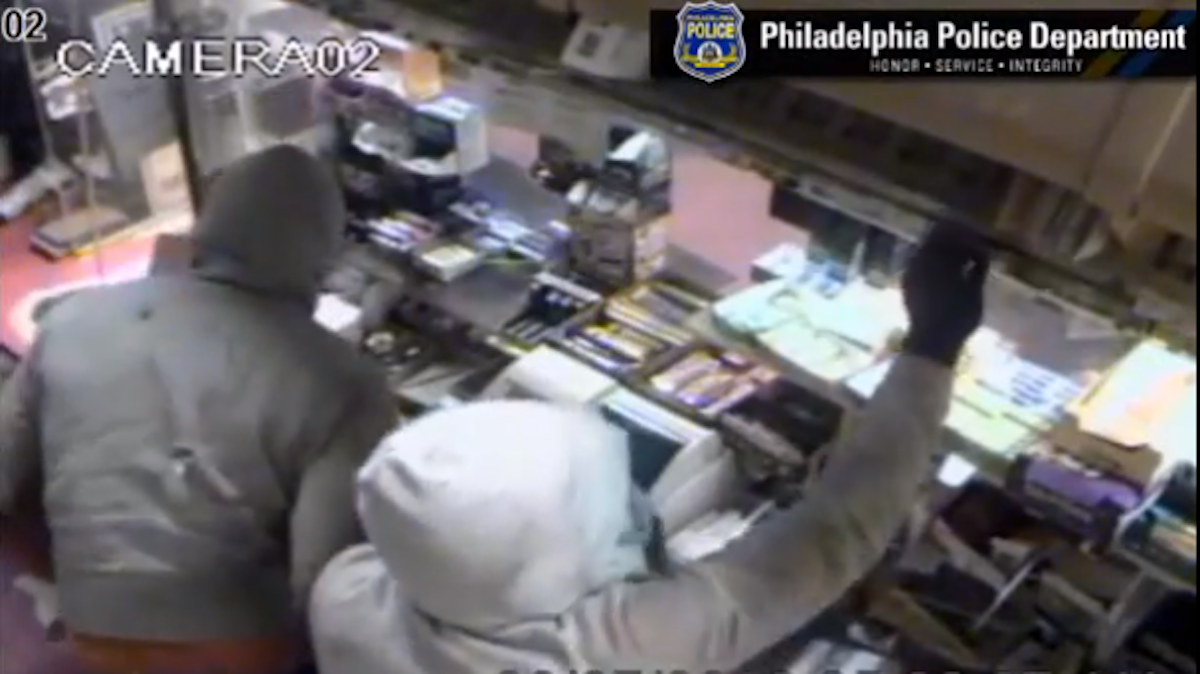 screen-shot-2013-08-28-at-10-01-33-am The unknown burglars left Lee's Steaks and Hoagies with more than $2,500 in cash and a bunch of cigarettes. (Photo courtesy of Philadelphia Police)