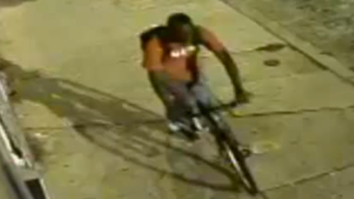  Surveillance footage of the alleged robber making off on his victim's bicycle. (Courtesy of PPD) 