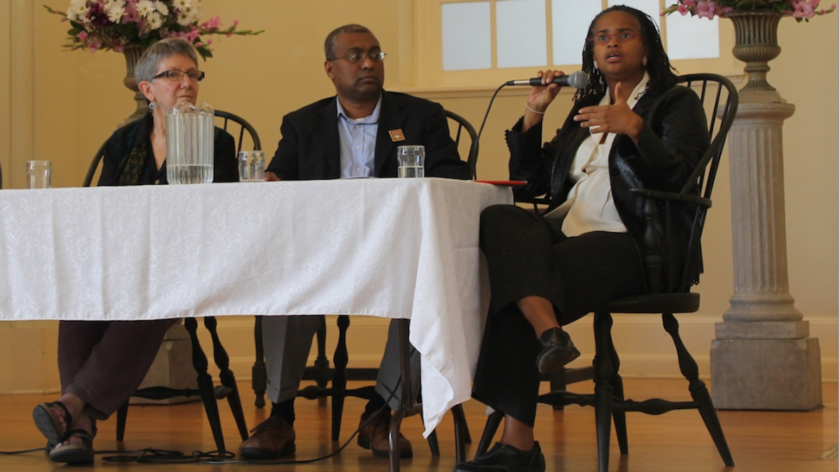  Rev. Leslie Callahan, seated with Iftekhar Hussain and Rabbi Linda Holtzman, examines gun violence through the lens of theology at Sunday's event in Chestnut Hill. (Matthew Grady/for NewsWorks) 