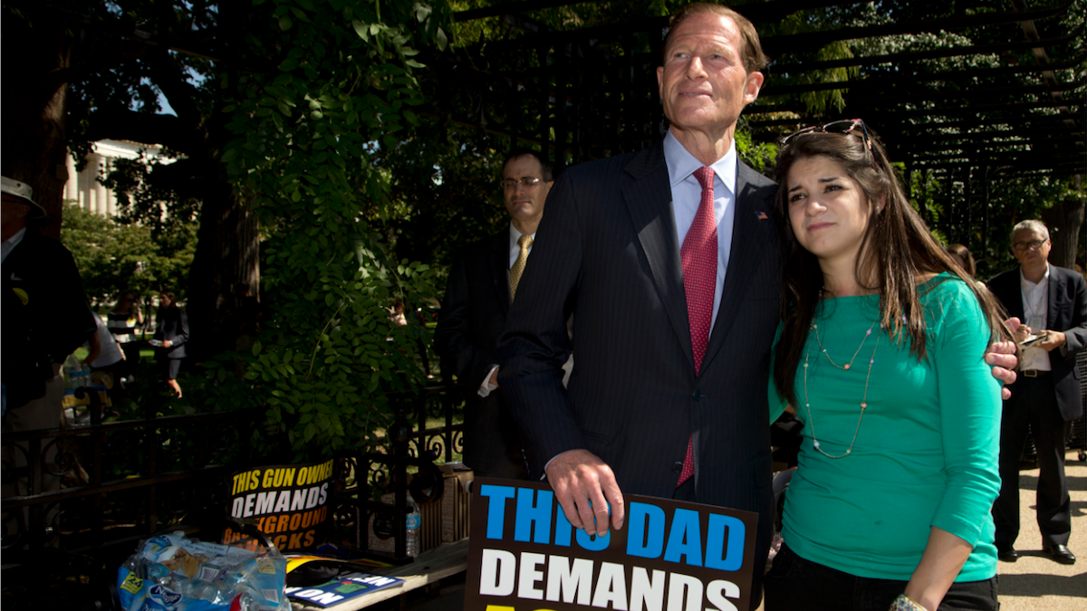  Sen. Richard Blumenthal, D-Conn., puts his arm around Carlee Soto, sister of Newtown victim and Sandy Hook teacher Victoria Soto, as prayers were offered during a Sept. 19 rally on Capitol Hill. (AP Photo/Manuel Balce Ceneta) 