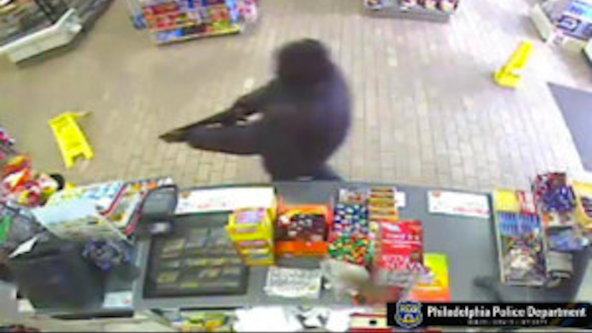  Surveillance footage of the man who used a sawed-off shotgun to rob a Stenton Avenue convenience store on Tuesday morning. (Photo courtesy of the Philadelphia Police Department) 