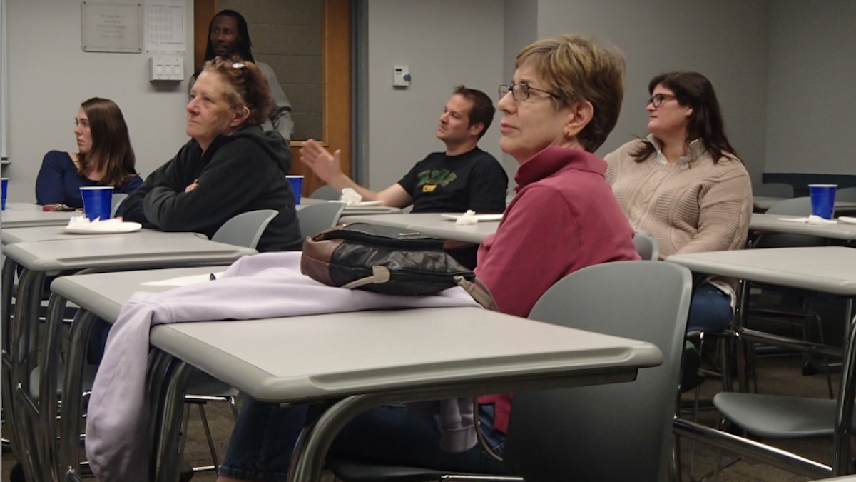  A training session for dog walkers who hope to help the East Falls Town Watch Association was held Tuesday night. (Queen Muse/for NewsWorks) 