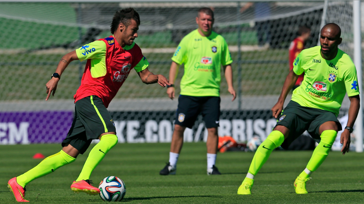  Brazil's Neymar, left, dribbles the ball against Maicon during a practice session at the Granja Comary training center in Teresopolis, Brazil, on Thursday. Brazil and Croatia will face off in the opening match on June 12. (AP Photo/Hassan Ammar) 