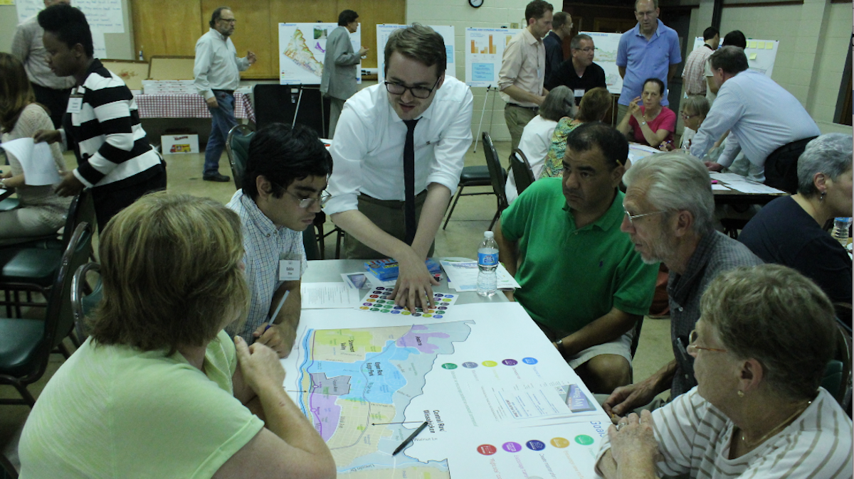  Kevin Hunter, of the city Commerce Department, leads residents in a discussion of planning issues on Thursday night. (Matt Grady/for NewsWorks) 